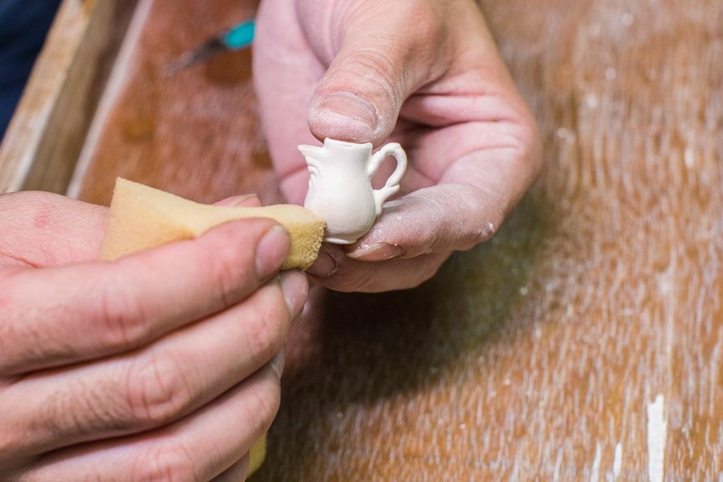 Jugs are carefully plastered with sponge
